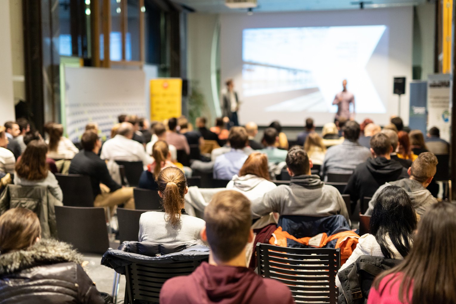 Business Speaker Giving a Talk at Business Conference Event